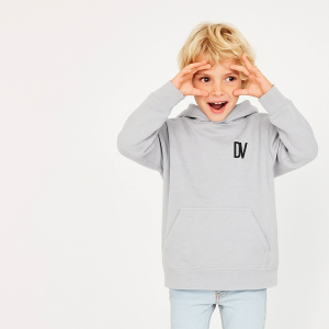 Boy in grey hoodie making a funny face.